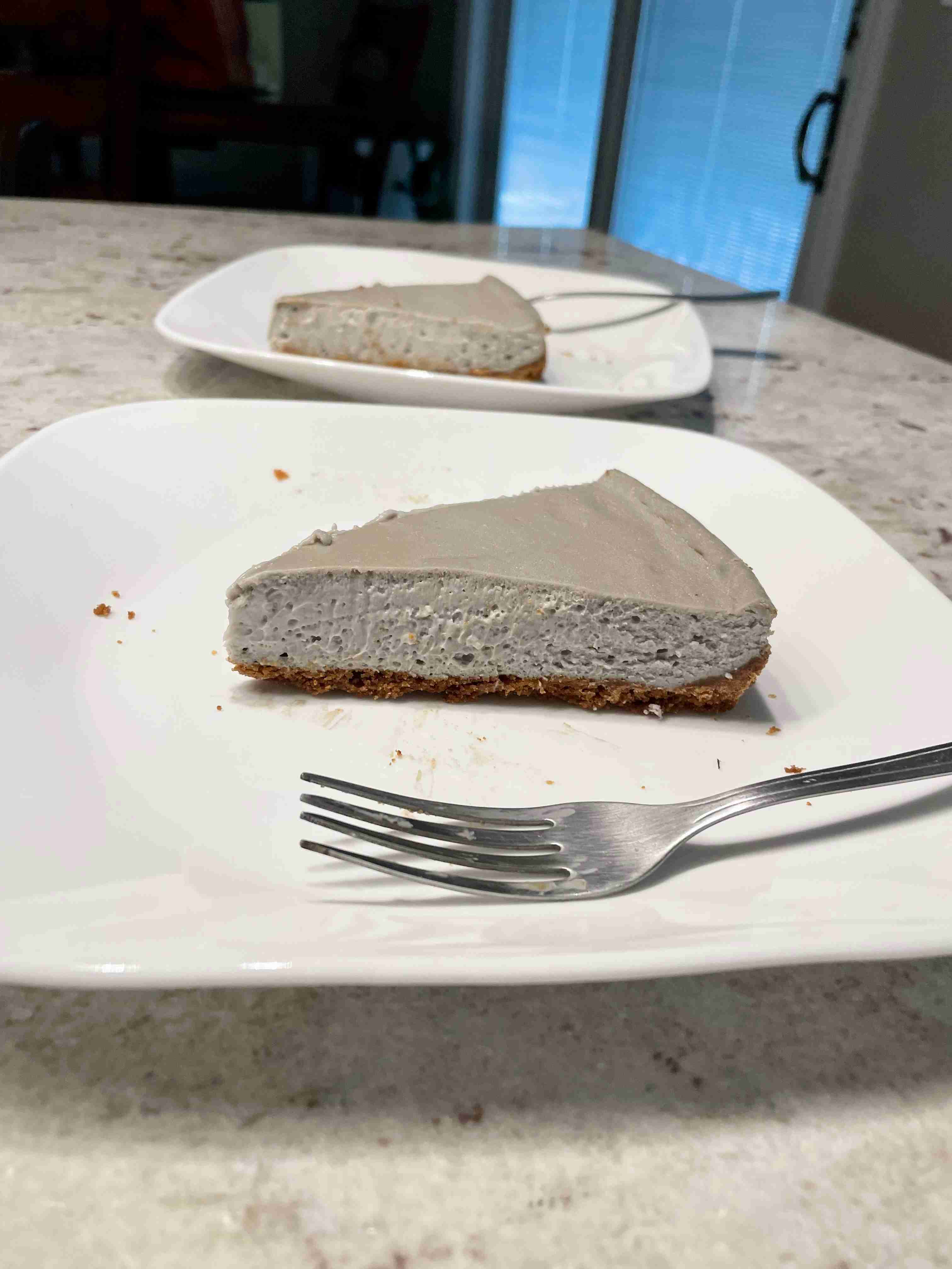 Cheesecake slice showing creamy interior