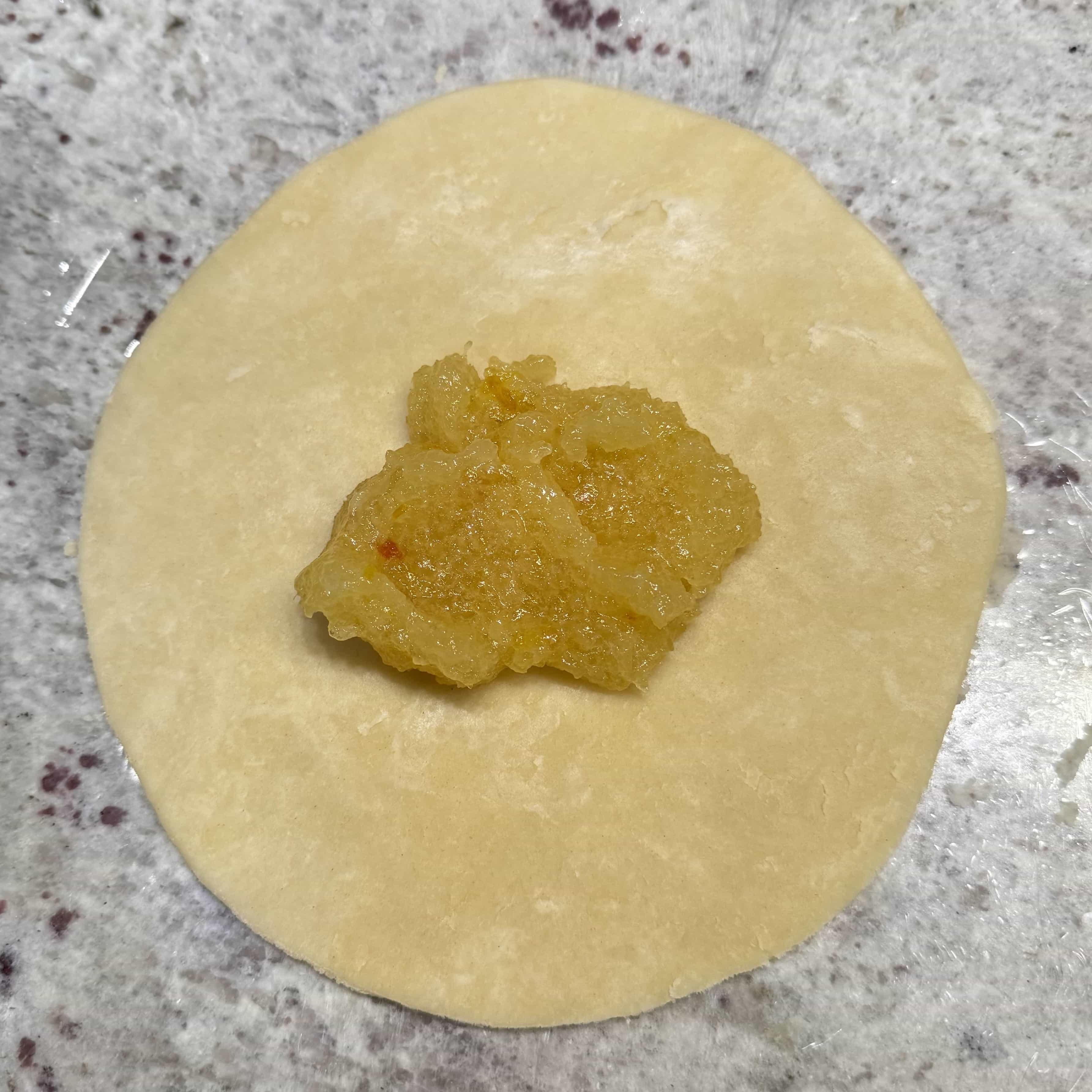 Pineapple and pepper jelly filling in the center of pastry circles