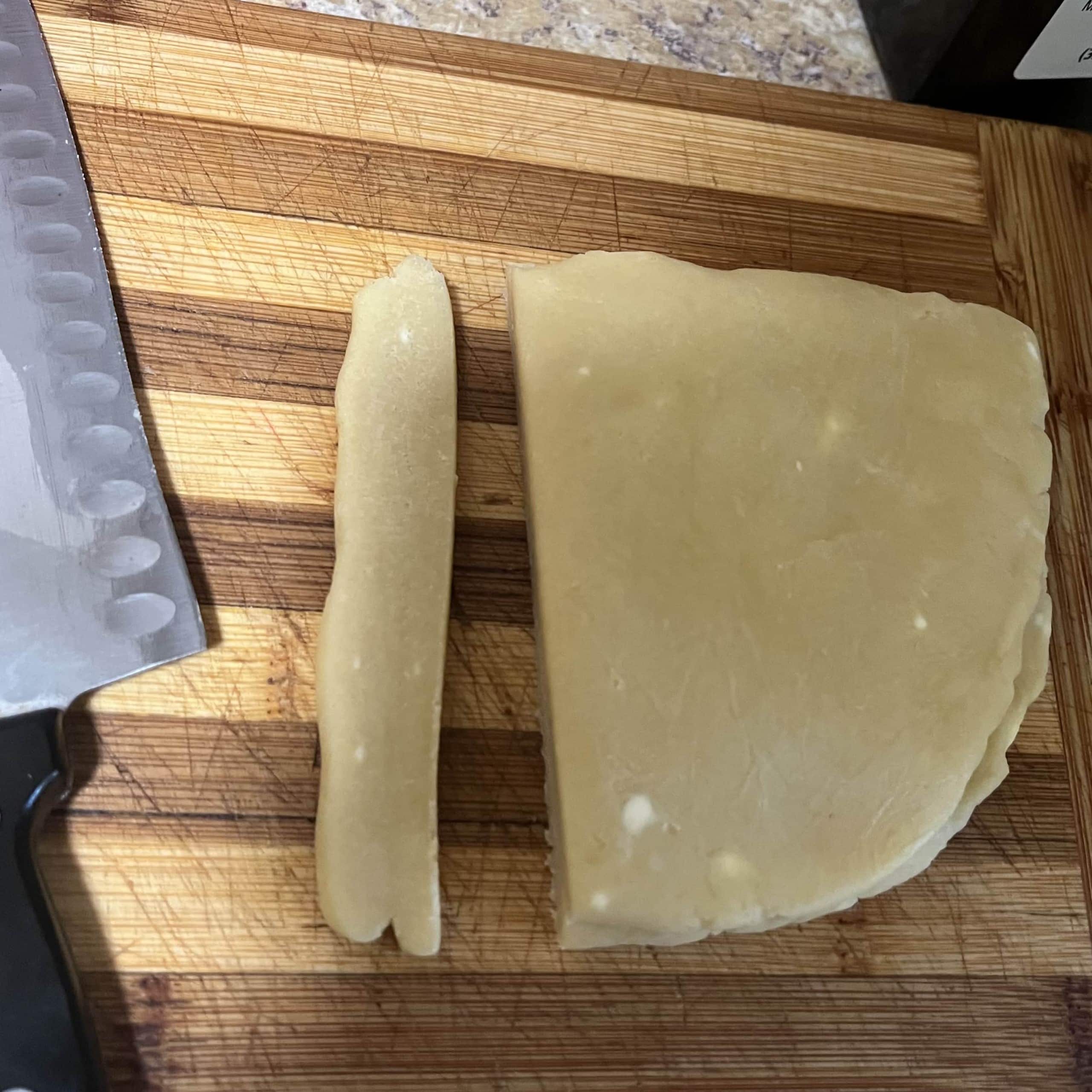 Chilled sweet pastry dough cut in half